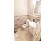 Simple bathroom with white vanity and wood-look tile at 2521 Avenue A Sw, Winter Haven, FL 33880