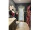 Clean bathroom with dark tile and updated vanity at 2521 Avenue A Sw, Winter Haven, FL 33880