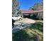 Home with a long driveway and red metal roof at 2521 Avenue A Sw, Winter Haven, FL 33880