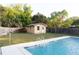 Inviting pool area with a large shed at 2521 Avenue A Sw, Winter Haven, FL 33880