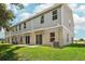 Two-story home with grey siding and backyard at 3322 Thicket St, Tavares, FL 32778