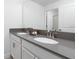 Double vanity bathroom with gray countertops and modern fixtures at 4241 Paragraph Dr, Kissimmee, FL 34746
