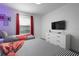 bedroom with twin beds and red accents at 4241 Paragraph Dr, Kissimmee, FL 34746
