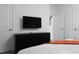 Well-appointed bedroom with mounted TV and dresser at 4241 Paragraph Dr, Kissimmee, FL 34746