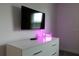 Stylish bedroom with a modern dresser and TV at 4241 Paragraph Dr, Kissimmee, FL 34746