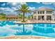 Large community pool with a clubhouse and lounge chairs at 4241 Paragraph Dr, Kissimmee, FL 34746