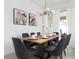 Elegant dining room with a large wooden table and eight chairs at 4241 Paragraph Dr, Kissimmee, FL 34746