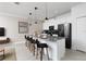 Stylish kitchen boasts white cabinets and a breakfast bar at 4241 Paragraph Dr, Kissimmee, FL 34746