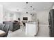 Modern kitchen with white cabinets, gray countertops, and island at 4241 Paragraph Dr, Kissimmee, FL 34746