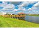 Lakeside gazebo with a wooden deck and scenic views at 4241 Paragraph Dr, Kissimmee, FL 34746
