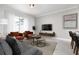 Cozy living room featuring neutral tones and comfortable seating at 4241 Paragraph Dr, Kissimmee, FL 34746