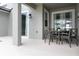 Private patio with table and chairs, adjacent to the pool at 4241 Paragraph Dr, Kissimmee, FL 34746