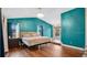 Spacious primary bedroom with large windows and wood flooring at 45 Sackett Rd, Debary, FL 32713