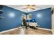 Bright home office features wood-look floors, built-in shelving, and a large workspace at 45 Sackett Rd, Debary, FL 32713