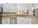Updated kitchen featuring stainless steel appliances and white cabinets at 45 Sackett Rd, Debary, FL 32713