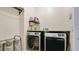 Laundry room with washer, dryer, and extra shelving at 45 Sackett Rd, Debary, FL 32713