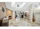 Open living area with a stone fireplace and tiled floors at 45 Sackett Rd, Debary, FL 32713