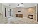Spacious living room with stone fireplace and tiled floors at 45 Sackett Rd, Debary, FL 32713