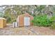 Wooden storage shed in backyard at 45 Sackett Rd, Debary, FL 32713