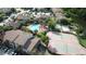 Condominium complex featuring a pool, tennis courts, and a lake at 4601 Cason Cove Dr # 214, Orlando, FL 32811