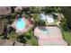Aerial view showing resort-style pool, tennis courts, and playground at 4601 Cason Cove Dr # 214, Orlando, FL 32811