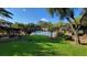 Community pool with a brick pavilion at 4601 Cason Cove Dr # 214, Orlando, FL 32811