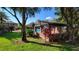 Community pool with brick patio and covered seating at 4601 Cason Cove Dr # 214, Orlando, FL 32811