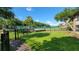 Community tennis court with surrounding fence at 4601 Cason Cove Dr # 214, Orlando, FL 32811