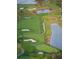 Aerial view of golf course with water features at 513 Mirasol Cir # 101, Celebration, FL 34747