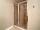 Clean bathroom with a tiled shower and glass enclosure at 513 Mirasol Cir # 101, Celebration, FL 34747