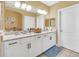 Double vanity bathroom with granite countertop at 513 Mirasol Cir # 101, Celebration, FL 34747