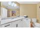 Another bathroom with granite countertop and white cabinets at 513 Mirasol Cir # 101, Celebration, FL 34747