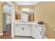 Bathroom boasts a granite countertop and white cabinets at 513 Mirasol Cir # 101, Celebration, FL 34747