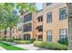 Condo building exterior showcasing architectural details and landscaping at 513 Mirasol Cir # 101, Celebration, FL 34747