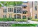 Inviting condo building exterior with lush landscaping and balconies at 513 Mirasol Cir # 101, Celebration, FL 34747