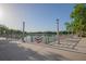 Serene lakeside pathway with scenic views and charming light posts at 513 Mirasol Cir # 101, Celebration, FL 34747