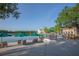 Tranquil lakefront patio with seating and umbrellas, offering scenic views at 513 Mirasol Cir # 101, Celebration, FL 34747