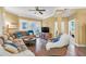Spacious living room featuring a sectional sofa and hardwood floors at 513 Mirasol Cir # 101, Celebration, FL 34747
