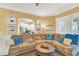 Comfortable living room with sectional sofa and views into the kitchen at 513 Mirasol Cir # 101, Celebration, FL 34747