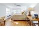 Spacious bedroom with hardwood floors and large windows at 6353 River Rd, New Smyrna Beach, FL 32169