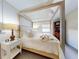 Main bedroom with canopy bed and nightstand at 6353 River Rd, New Smyrna Beach, FL 32169