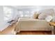 Bright bedroom with hardwood floors and a comfy bed at 6353 River Rd, New Smyrna Beach, FL 32169