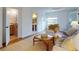 Living room, view of bathroom and access to bedroom at 6353 River Rd, New Smyrna Beach, FL 32169