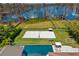 Aerial view of pool, volleyball court and lake at 9343 Tibet Pointe Cir, Windermere, FL 34786