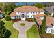 Luxury home with circular driveway and beautifully landscaped grounds at 9343 Tibet Pointe Cir, Windermere, FL 34786