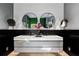 Modern bathroom with double vanity and large mirrors at 9343 Tibet Pointe Cir, Windermere, FL 34786