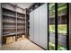 Elegant butler's pantry with glass-front cabinetry and ample shelving at 9343 Tibet Pointe Cir, Windermere, FL 34786