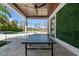 Outdoor ping pong table on covered patio with pool view at 9343 Tibet Pointe Cir, Windermere, FL 34786
