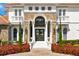 Grand entrance with stone accents and double doors at 9343 Tibet Pointe Cir, Windermere, FL 34786