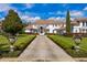 Grand two-story home with tile roof, stone accents, and manicured landscaping at 9343 Tibet Pointe Cir, Windermere, FL 34786
